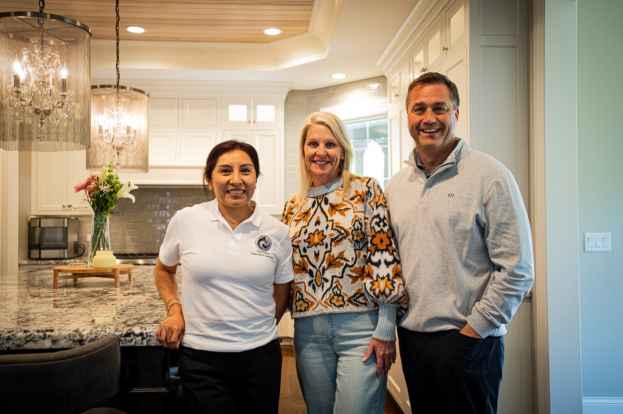 Jackie C standing with the Fuhr Family